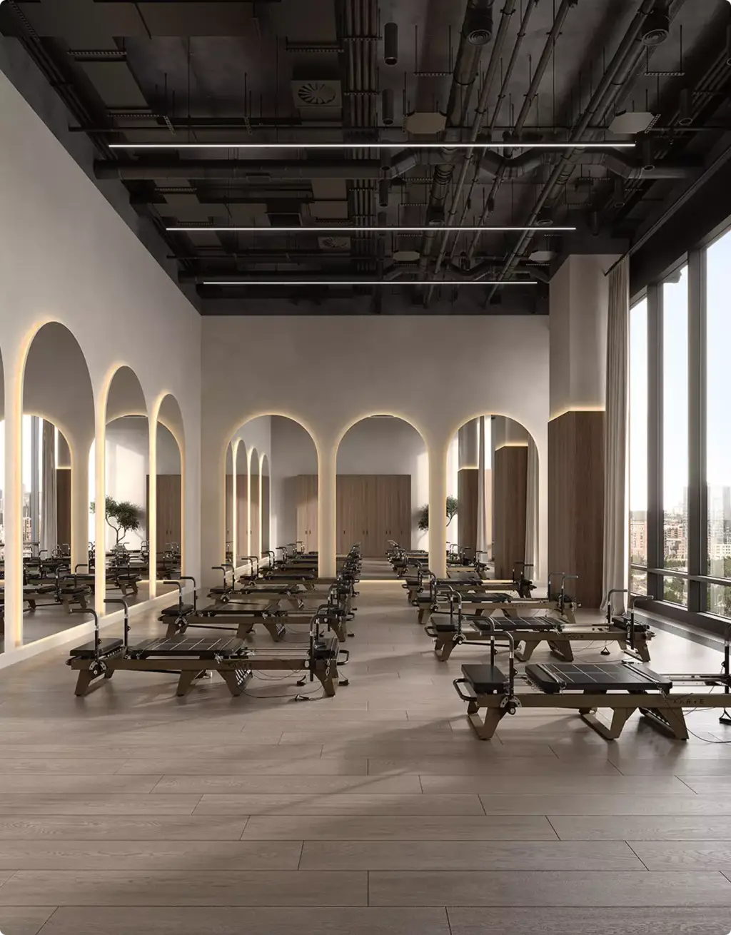 Pilatesstudio met reformers in 3D-interieurvisualisatie met verlichte boogspiegels en hoge ramen