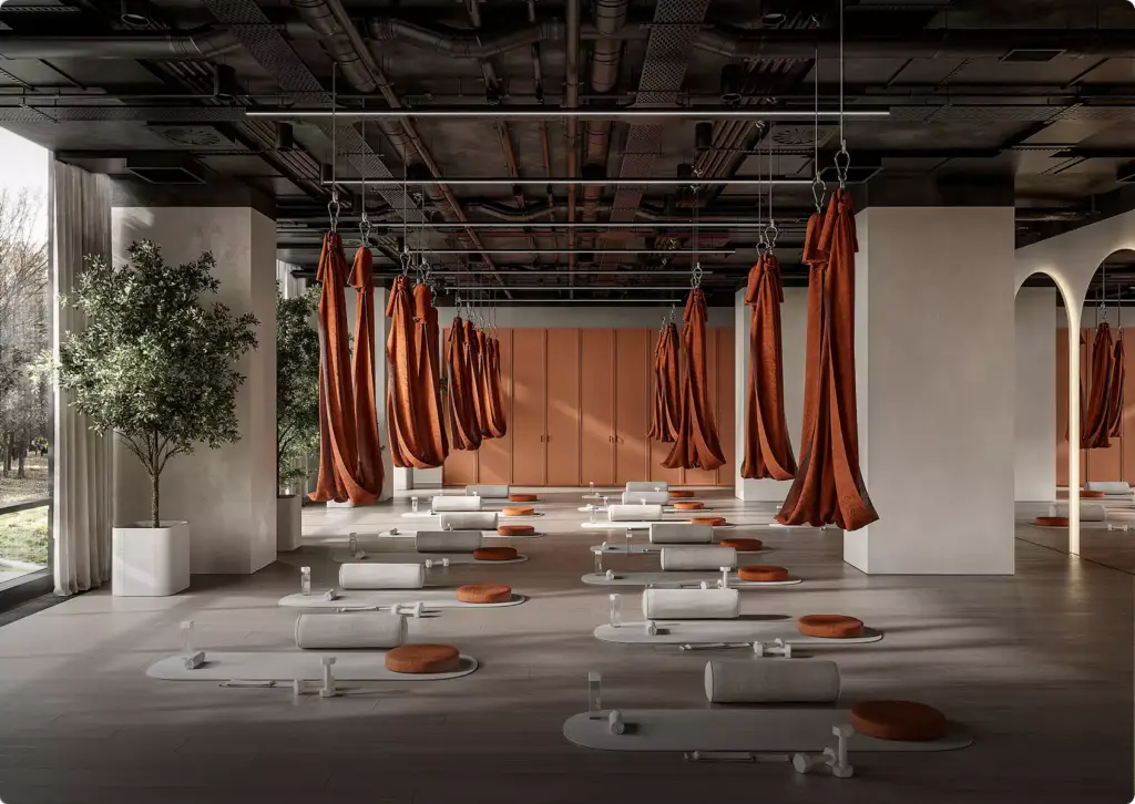 3D-interieurvisualisatie van een yogastudio met hangende doeken, matten, kussens en een open industrieel plafond