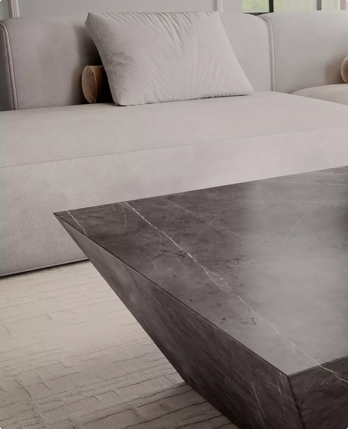3D furniture rendering of dark marble coffee table corner beside curved beige sofa with pillow