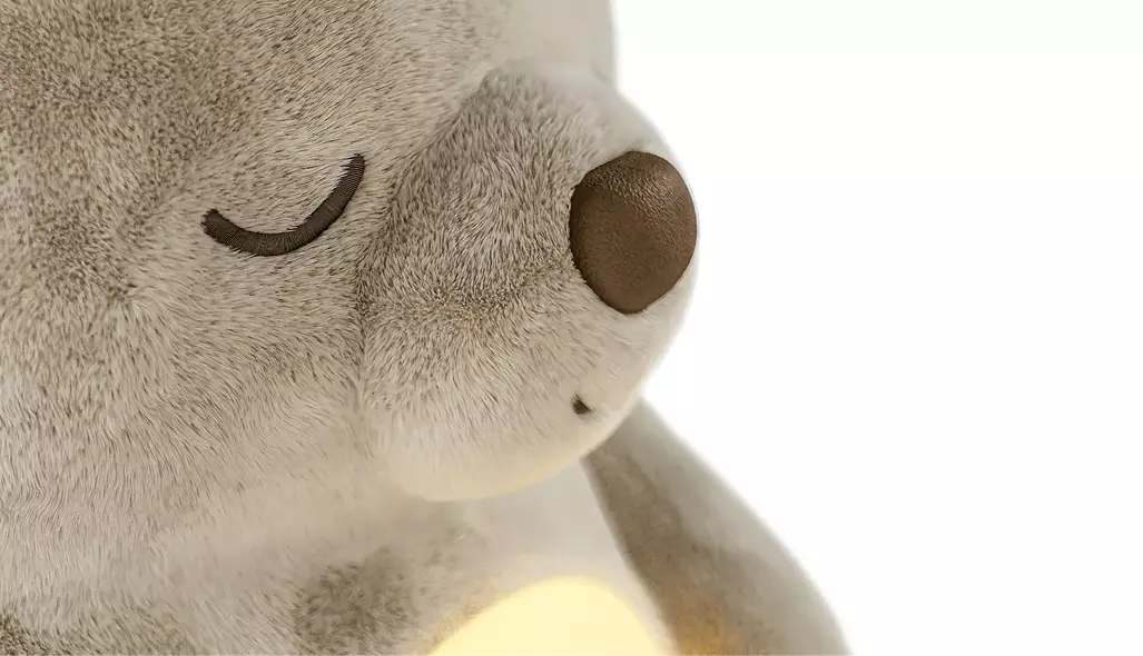 Render 3D de producto: primer plano de la cara de la lamparita de peluche con los ojos cerrados y el globo de luz encendido