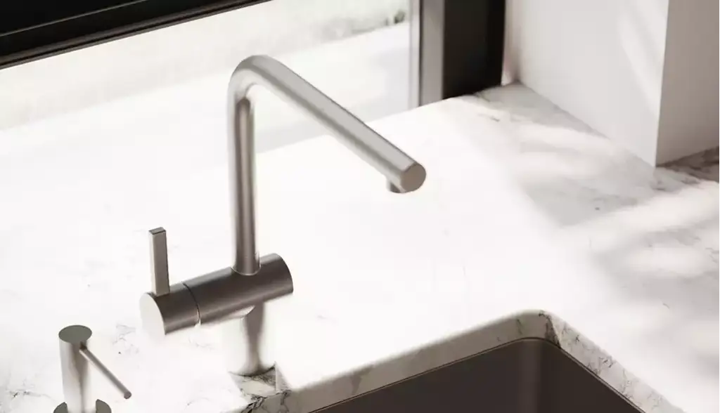 Close-up render of a steel tap over a marble kitchen worktop
