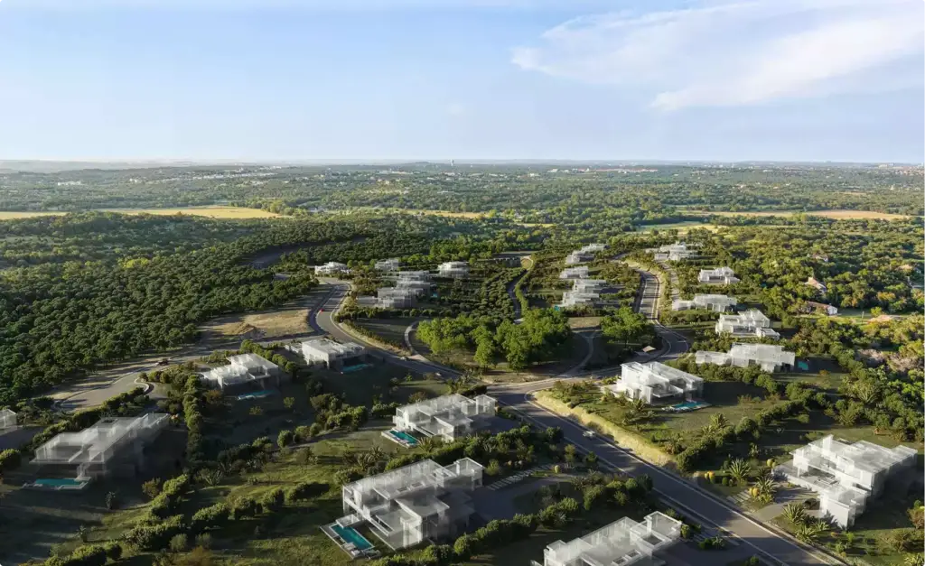 Render de vista aérea de una comunidad de villas en ladera, rodeada de vegetación densa, con carreteras sinuosas y casas modernas