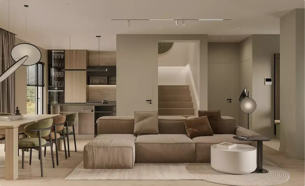 Render de un salón-cocina abierto con sofá, mesa de comedor y escalera