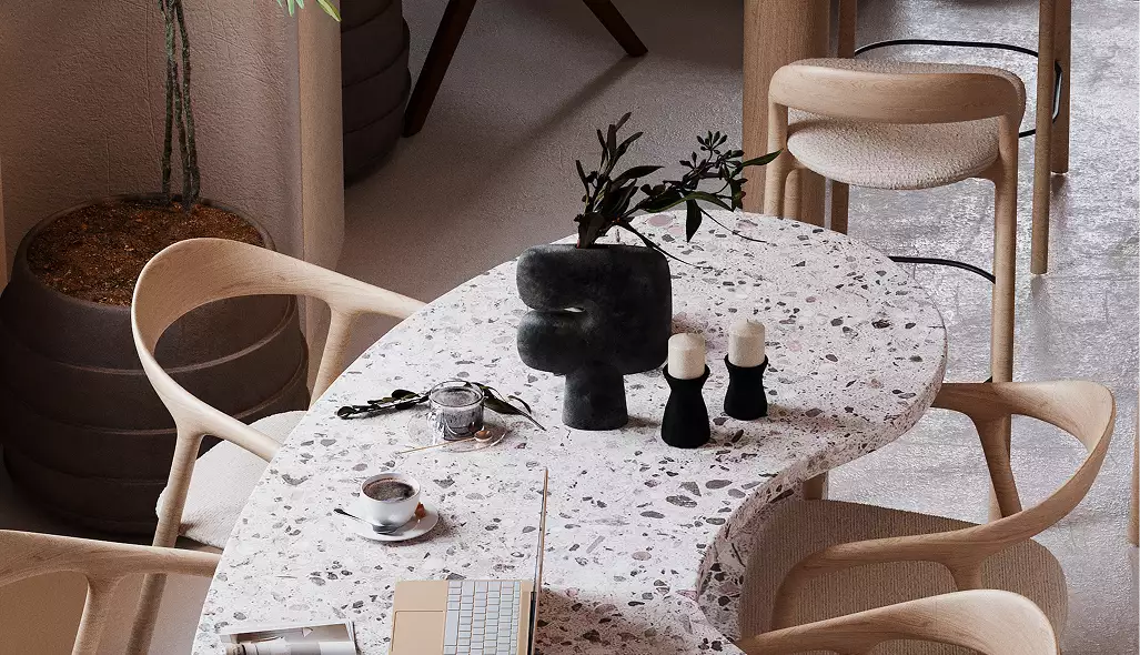 Visualizzazione di una caffetteria con tavolo in terrazzo, sedie in legno, tazza da caffè, candele, vaso decorativo e pianta in vaso