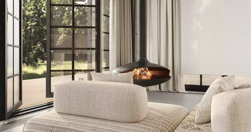 Interior modular homes lounge with curved seating, suspended fireplace, tall curtains, and windows