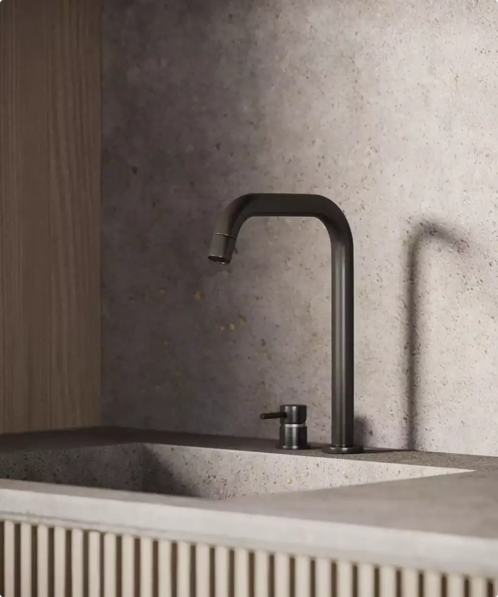 Render of a stone kitchen sink with a black tap and a textured stone splashback