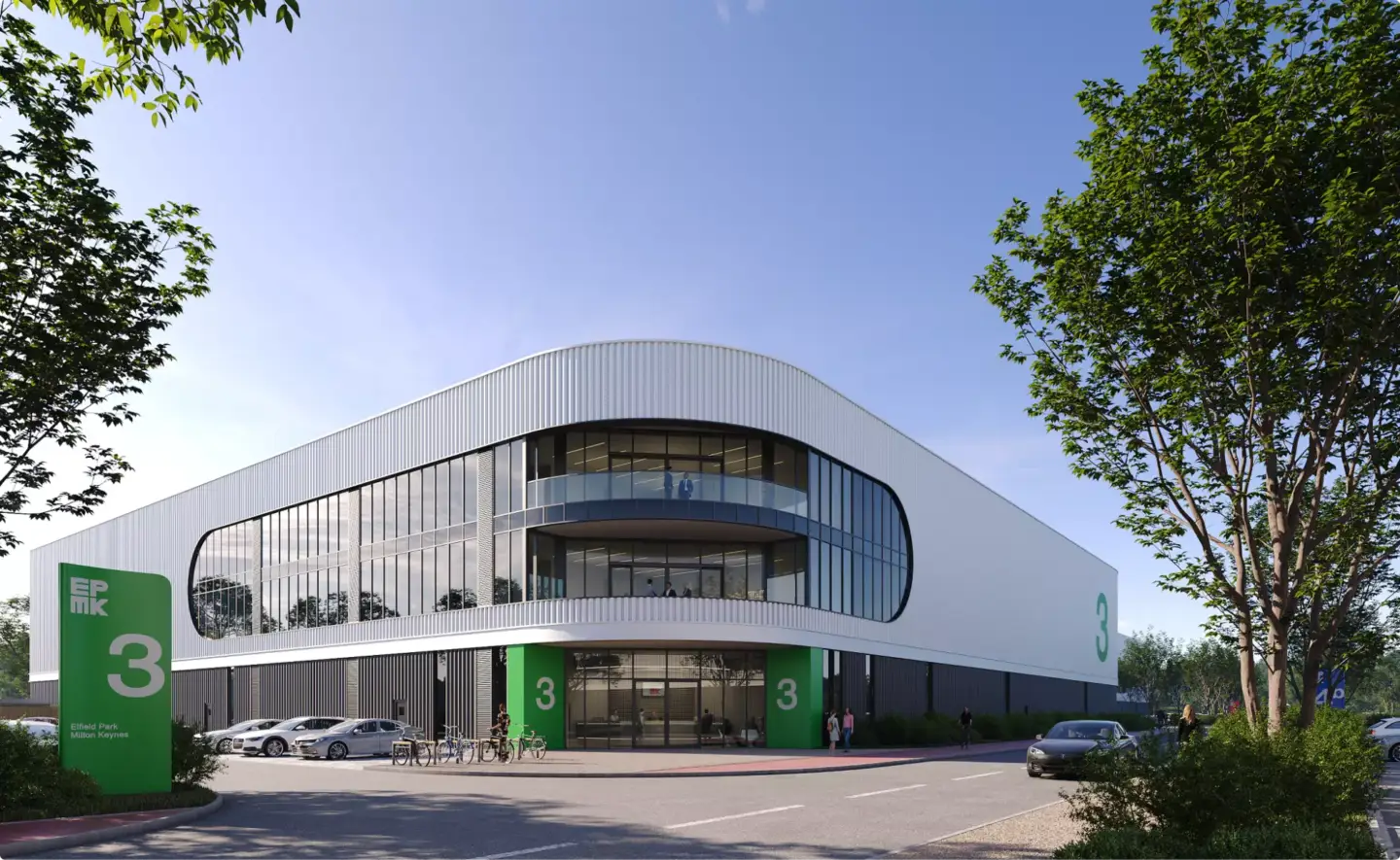 Curved modern office building with green signage, trees, bikes, and glass facade