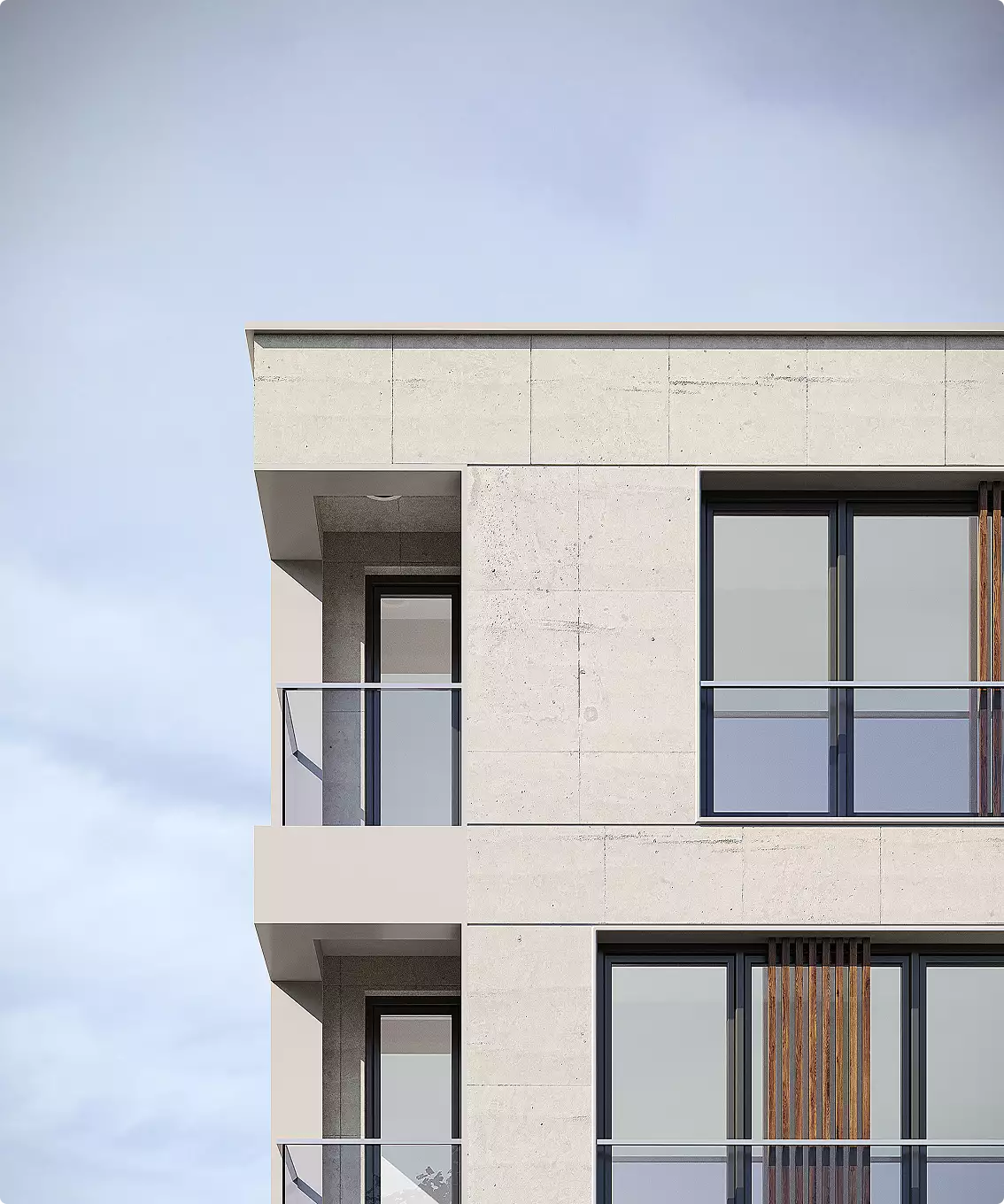 Hoek van het appartementengebouw met balkons en een minimalistische gevel