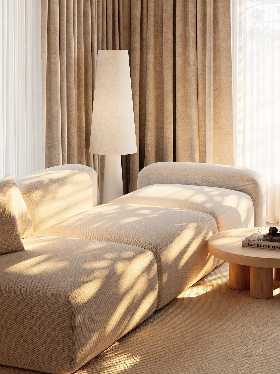 Scandinavian style lounge chairs with round wood table, tall floor lamp, and warm window light