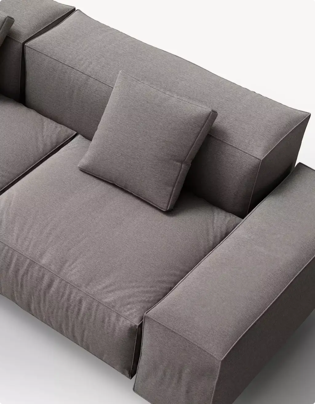 Portfolio Möbelvisualisierung: Detailaufnahme eines grauen Modulsofas und seiner Kissen