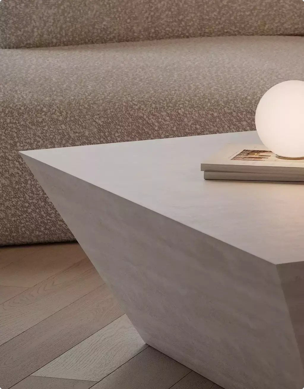 Portfolio Möbelvisualisierung: Couchtisch aus Stein neben geschwungenem Sofa mit strukturiertem Bezug