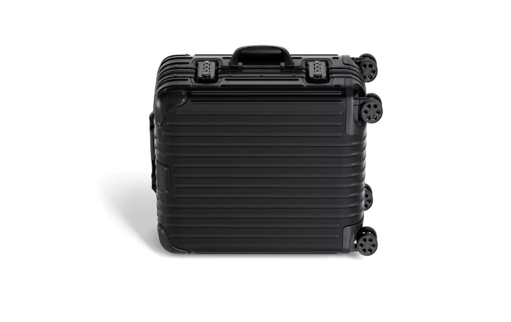 3D Product Rendering of black hard shell suitcase viewed from top angle
