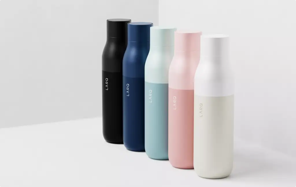 3D Product Rendering of pastel reusable water bottles arranged on white background