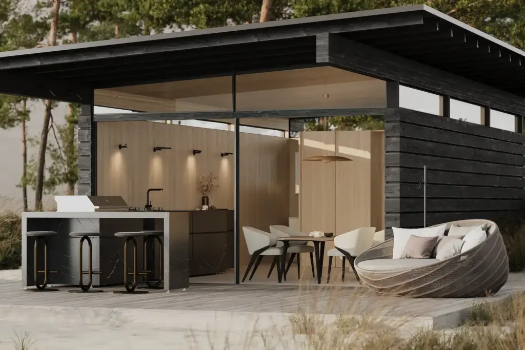 Render of a black timber-clad prefab house with full-height glazing, an outdoor kitchen and a terrace among pines
