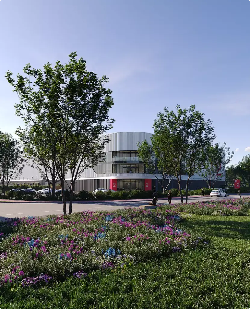 Rendering aereo del centro logistico con aiuole fiorite, alberi e la facciata moderna del magazzino