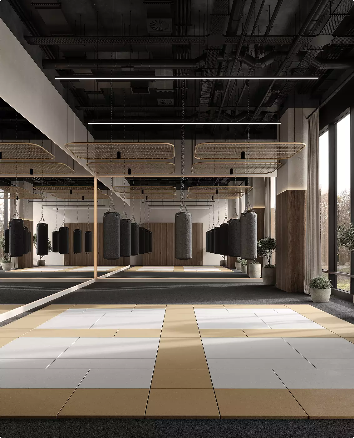 Sala boxe nel design di una palestra commerciale con sacchi, tappeti, specchi e illuminazione moderna