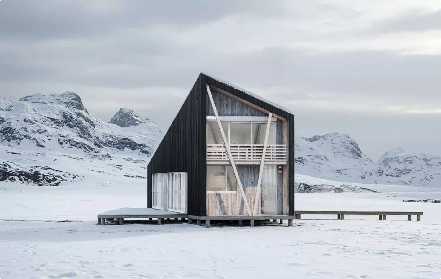 Modern cabin exterior rendering in snow with wooden facade, glass front, and mountain backdrop