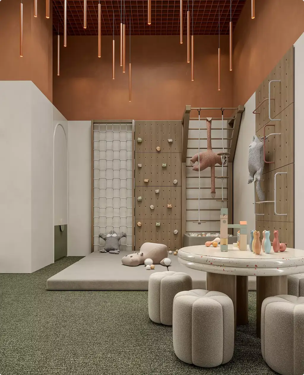 Area gioco per bambini nel progetto architettonico di un centro fitness con parete da arrampicata, sedute morbide e luce calda