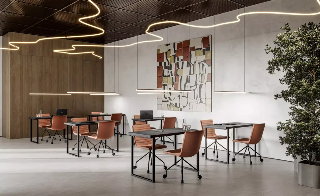 Area riunioni nel progetto architettonico di un centro fitness con scrivanie, sedie e opere astratte a parete