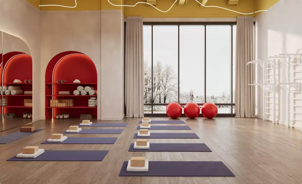 Studio yoga nel progetto architettonico di un centro fitness con tappetini, blocchi, accenti rossi e grande finestra