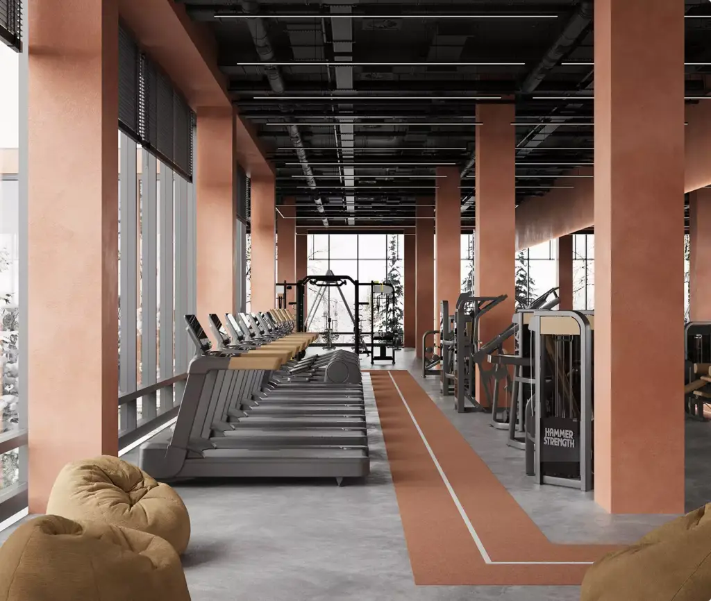 Area cardio moderna nell'interior design di un centro fitness con tapis roulant, macchine isotoniche e grandi vetrate
