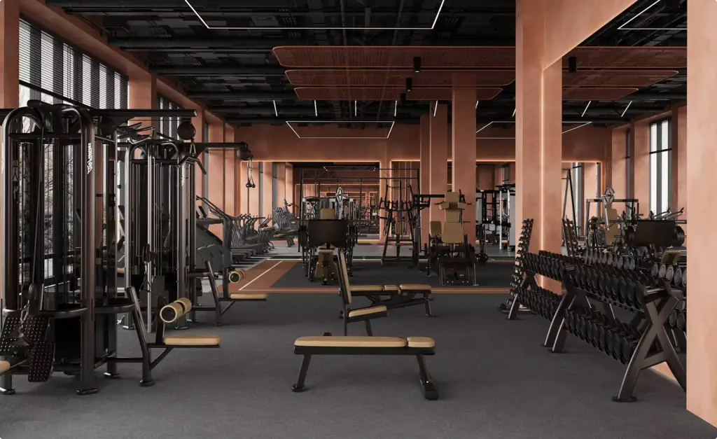 Sala pesi nell'interior design di un club fitness con macchine, panche, manubri e luce calda
