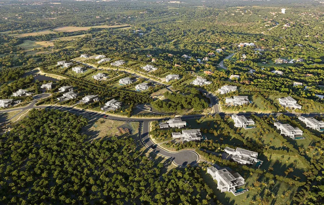 Vogelvluchtbeeld van een masterplan met wegen, woningen en groen landschap