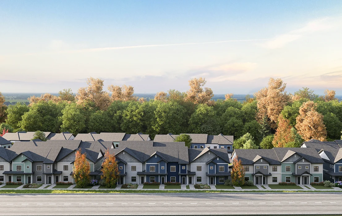 Rij woningen in een masterplanwijk vanaf straatniveau met bomen en landschap op de achtergrond