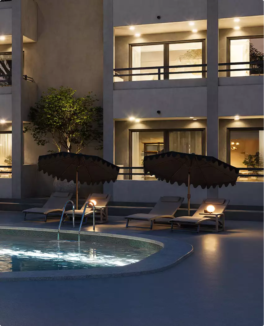 Render 3D de hotel junto a la piscina de noche con tumbonas, sombrillas y balcones iluminados