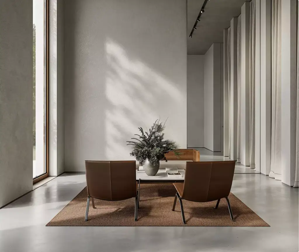 3D-visualisatie van winkelinrichting met loungehoek, stoelen, tafel en minimalistisch interieur met daglicht