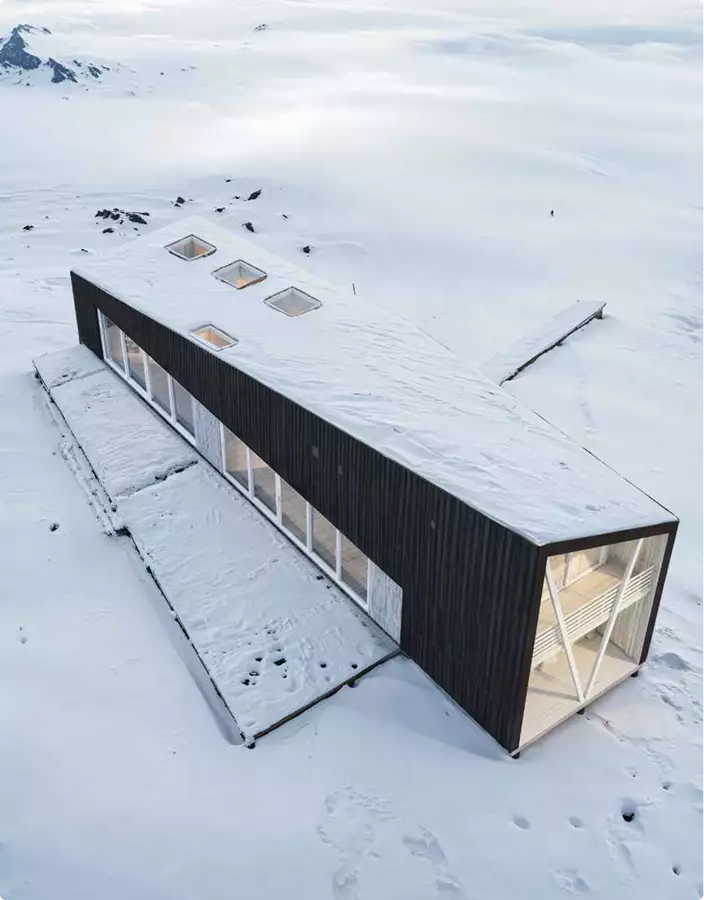 Minimalist cabin in snowy landscape with skylights and glass walls, Architectural Rendering Process