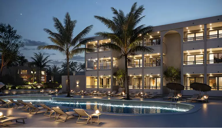 Hotel exterior at night with lit pool and balconies, best real estate CGI companies for property developers in 2026