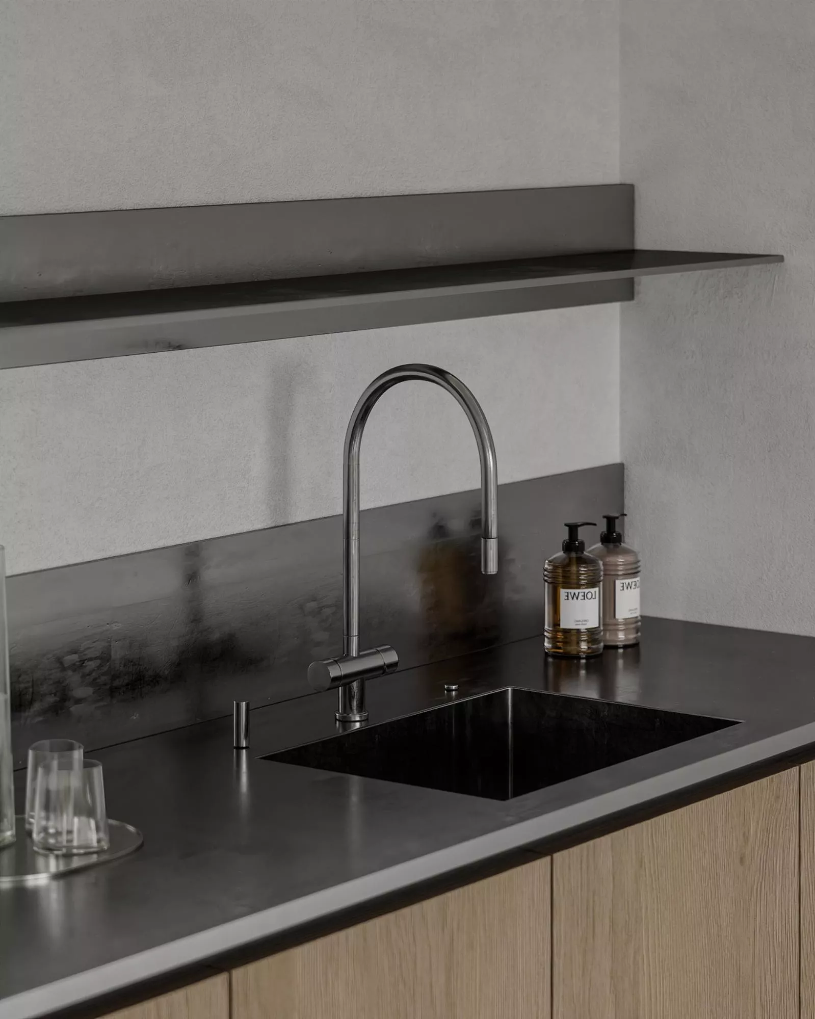 Minimal kitchen 3D visualization with black sink, steel faucet, and floating shelf