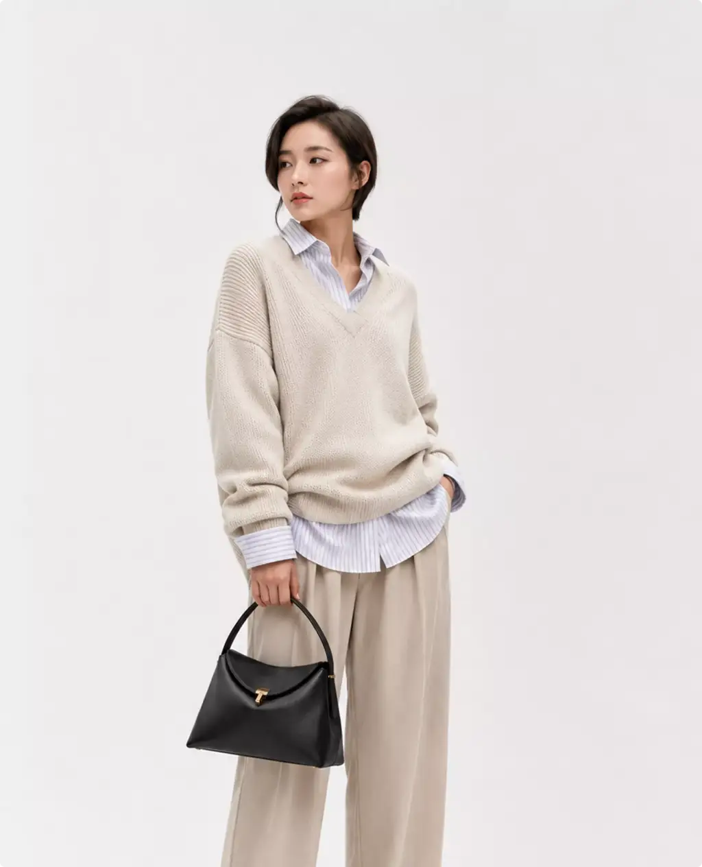 Photorealistic Toteme handbag CGI render with model in neutral outfit