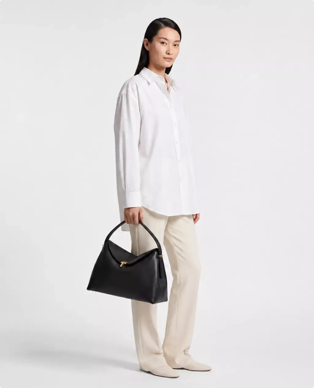 Premium leather Toteme bag CGI visualization with black bag and white outfit