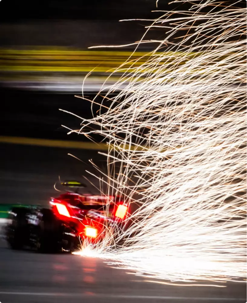Automotive CGI lifestyle scene of a luxury car on a race track with sparks