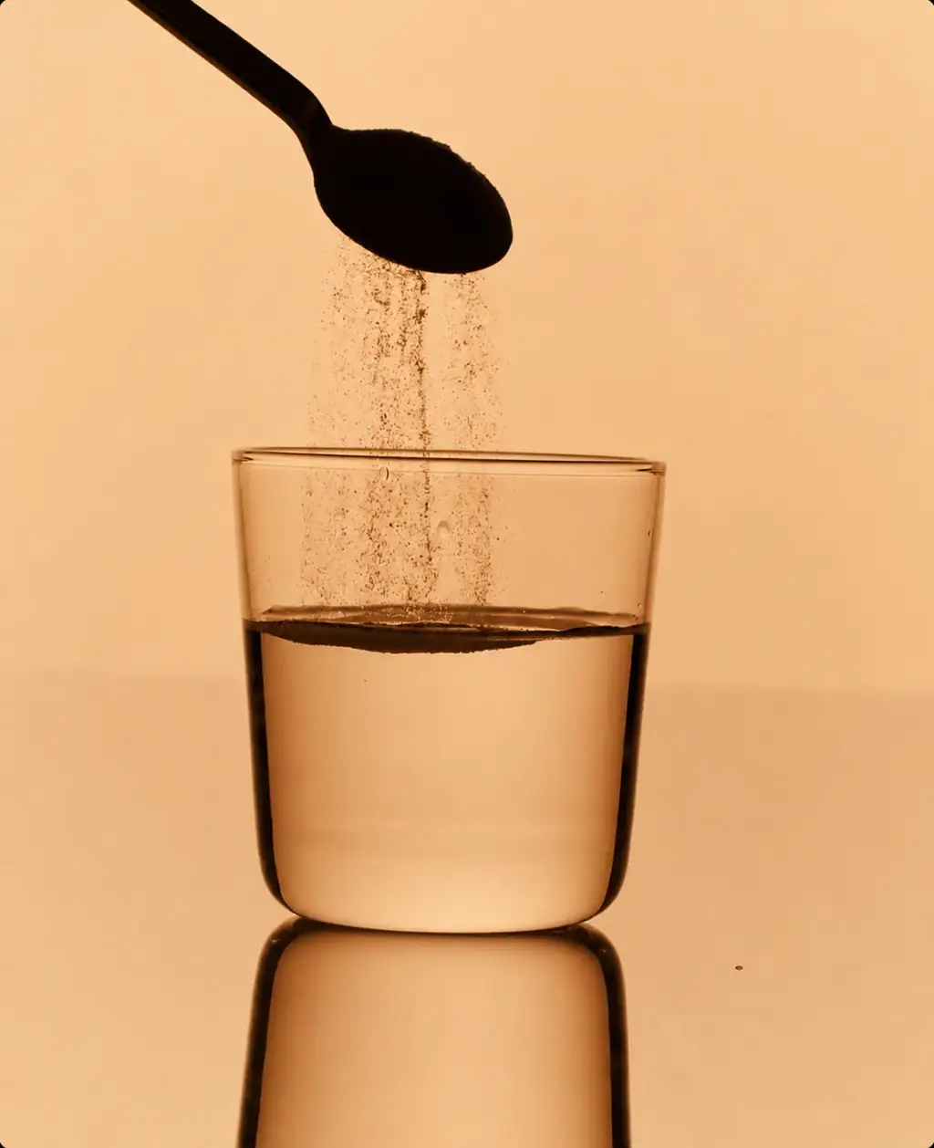 Electrolyte tablet dissolving in a glass of water