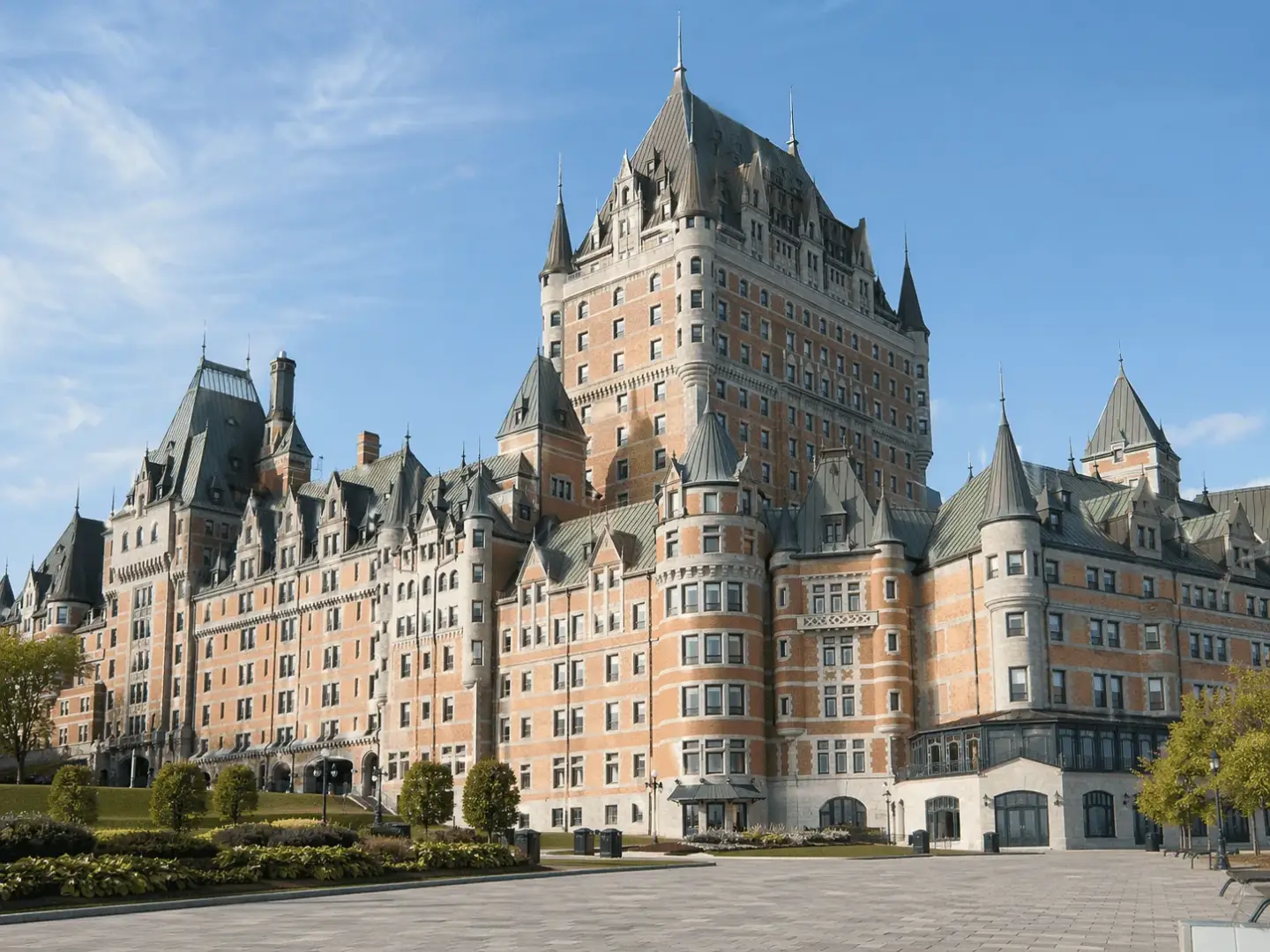 Historic Quebec hotel with steep copper roofs, turrets, and castle-like Victorian form