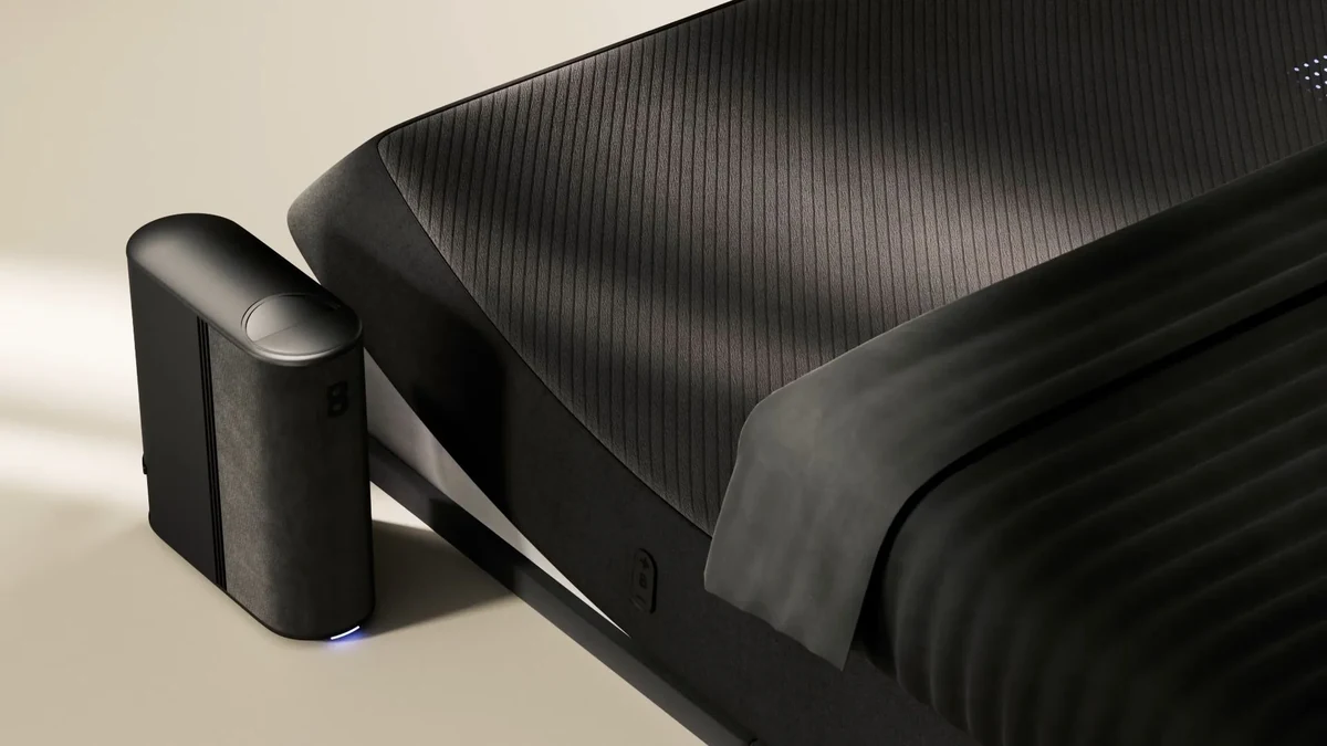Product rendering of a black smart bed with a temperature-control hub