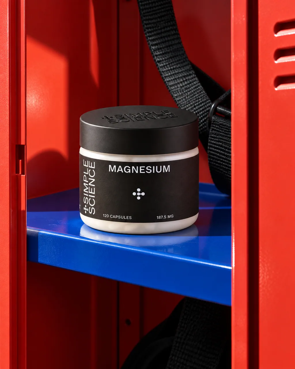 Simple Science magnesium jar on a shelf inside a red gym locker