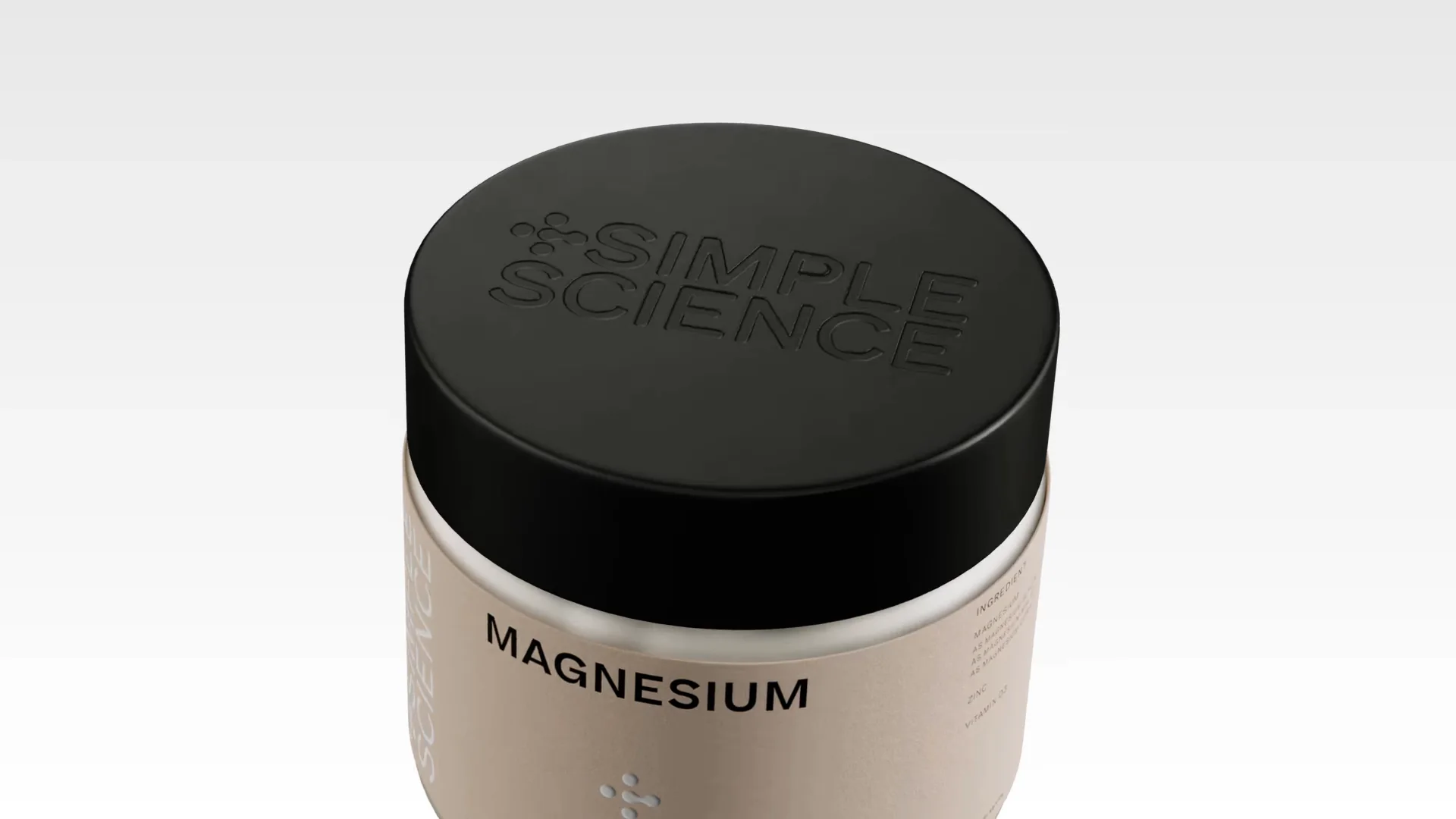Filmstill van het deksel van een pot magnesiumsupplement, van bovenaf gezien