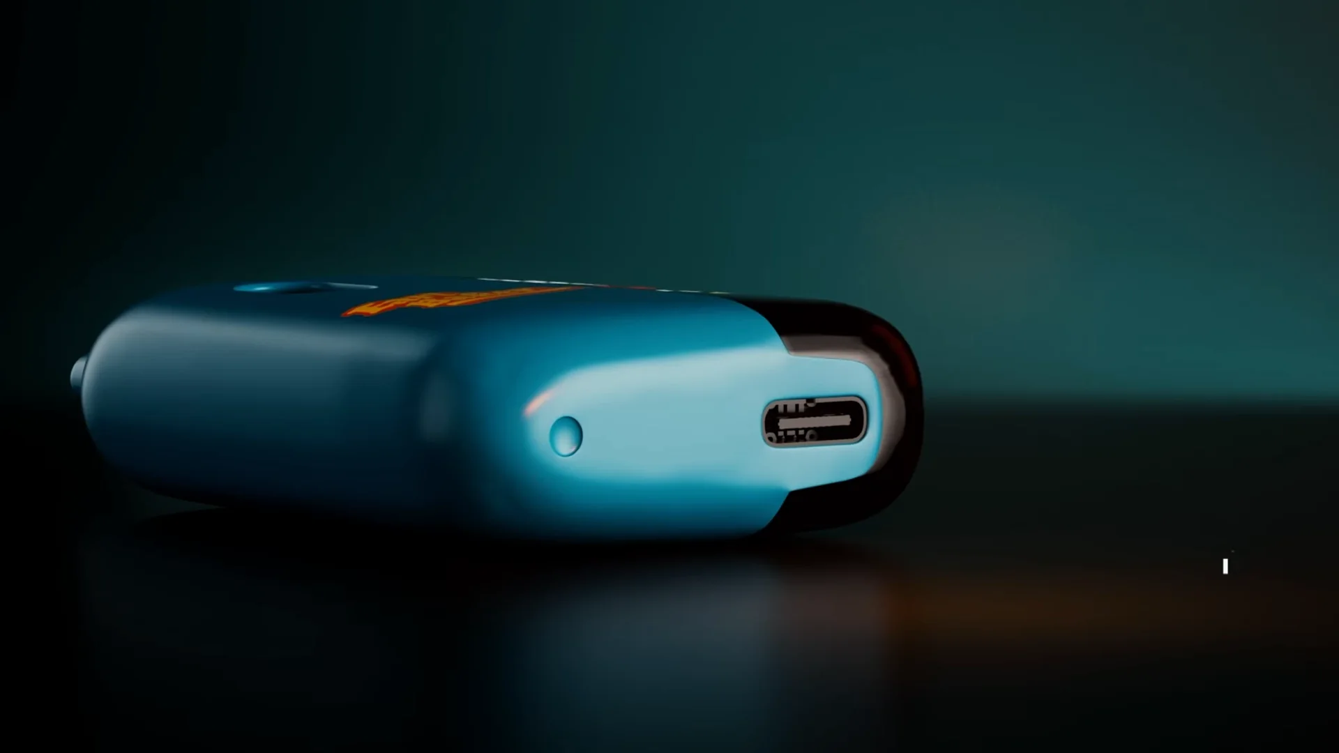 Filmstill van het blauwe vape-apparaat op een donker petrolkleurig oppervlak