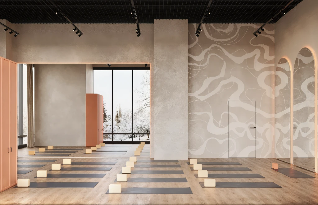Rendu 3D d'un studio de yoga paisible avec parquet, tapis gris et briques beiges bien rangées.