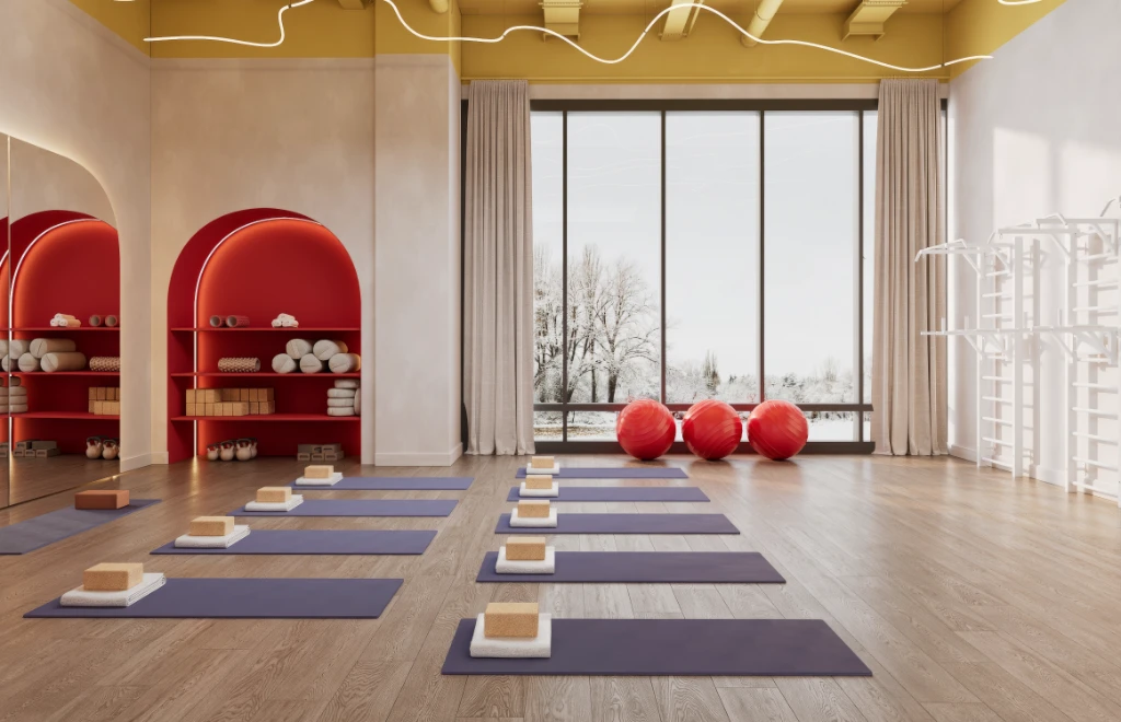 Rendu 3D d'un studio de yoga paisible avec tapis, briques et ballons, grandes fenêtres et étagères en arc.