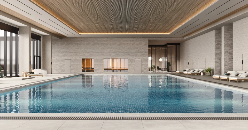 Rendu 3D d'une piscine intérieure paisible avec eau bleue, chaises longues blanches et murs en pierre grise.