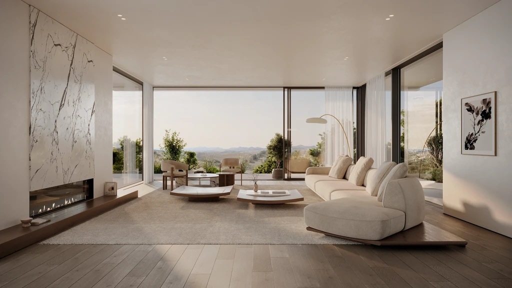 Living room with a marble feature wall and fireplace, a modular sofa and a view over green hills
