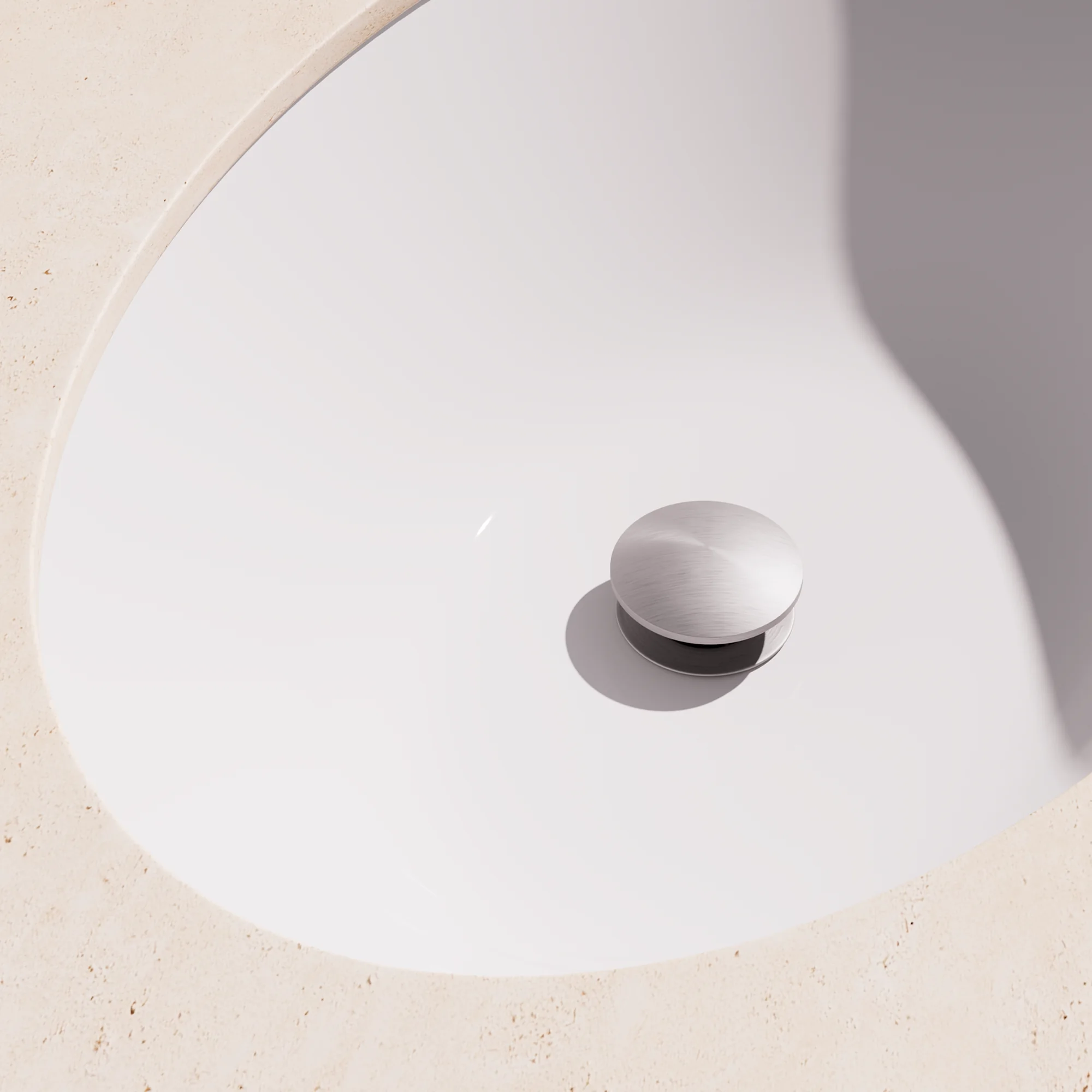 Render of a basin pop-up waste in brushed stainless inside a white basin