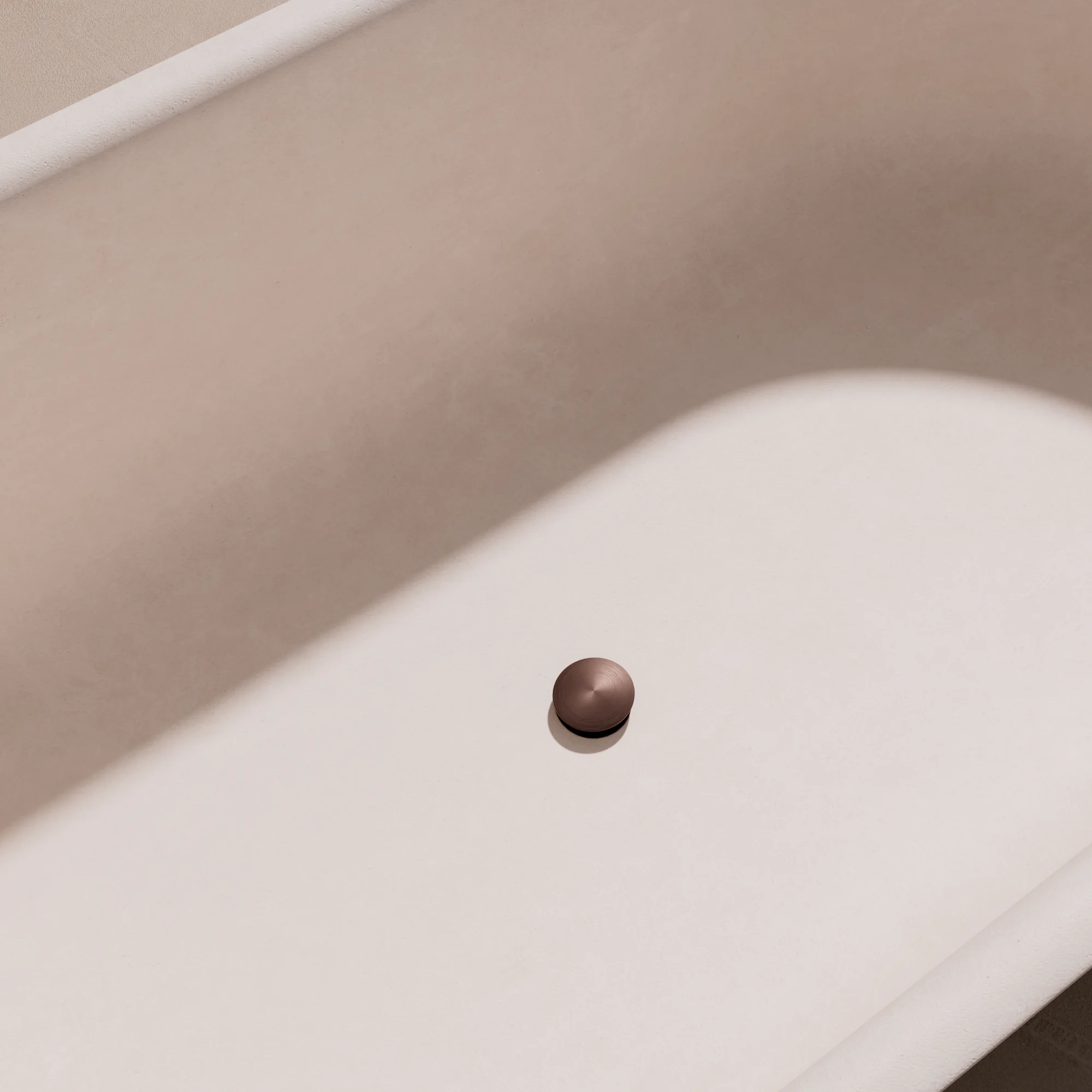 Render of a bath pop-up waste in satin bronze inside a white bath