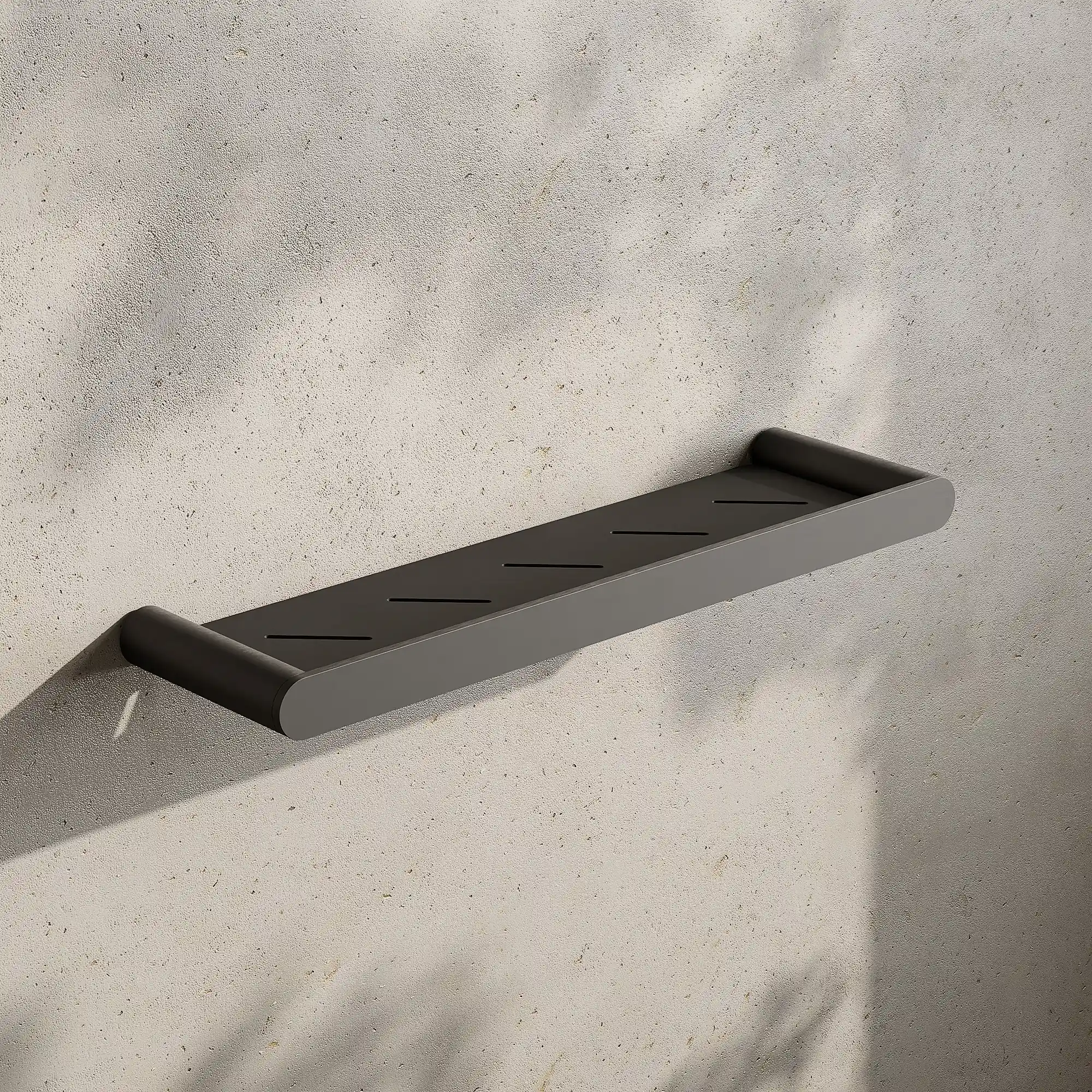 Render of a bathroom shelf in gunmetal black on a stone wall with leaf shadows