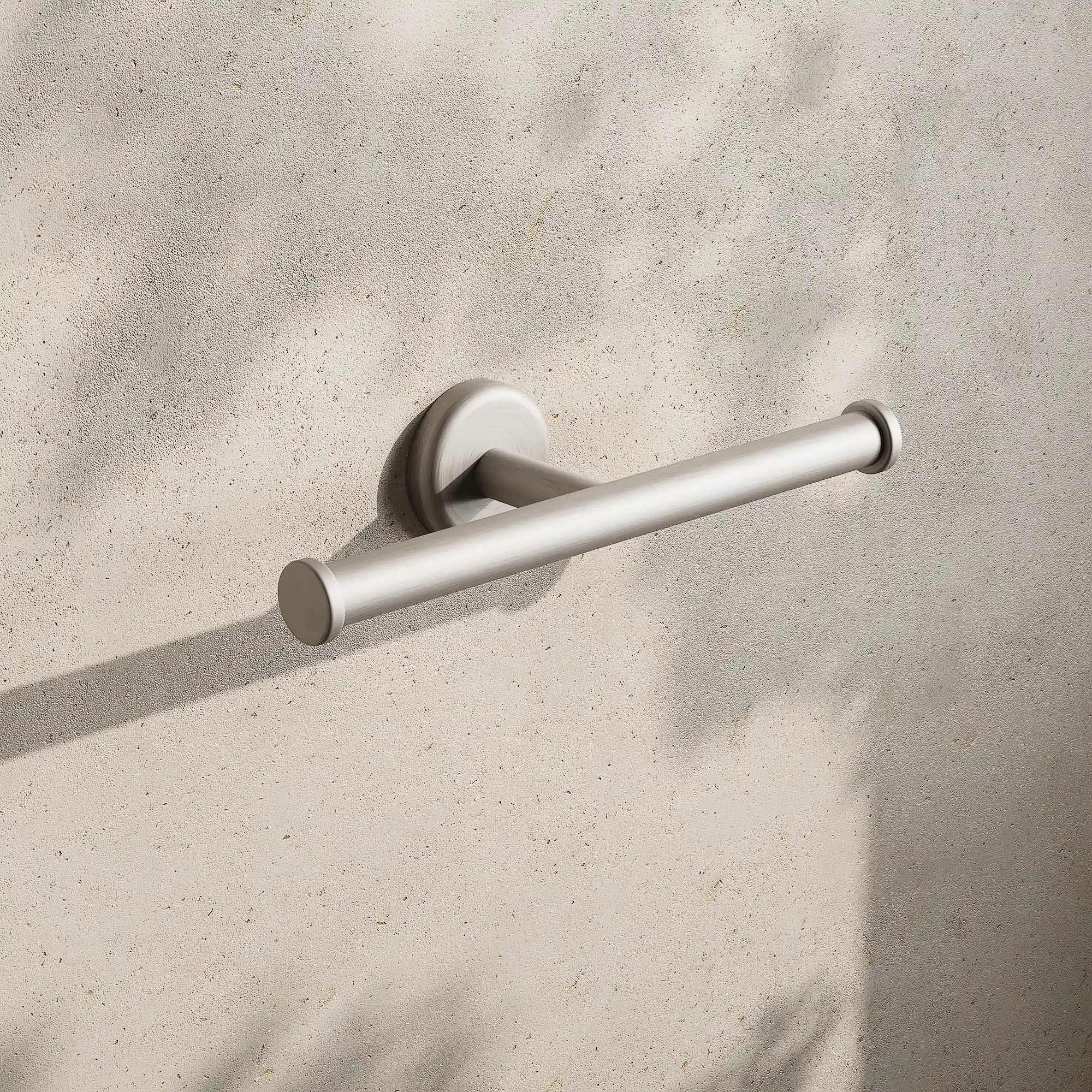 Render of a double toilet roll holder in brushed stainless on a stone wall